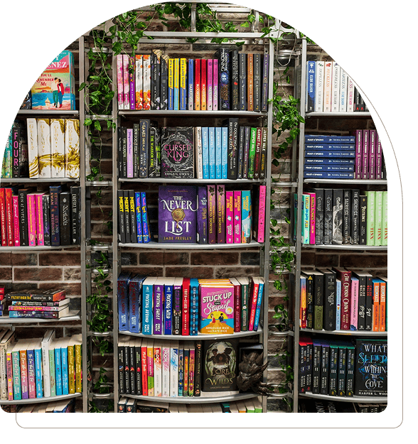 Bookshelves filled with colorful books in a bookstore or library.